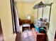 Bedroom with a desk, ottoman and storage trunks for organized living at 313 S Brittain Ave, Muncie, IN 47303