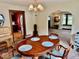 Bright dining room offering a view to the kitchen and a glimpse into the living area at 313 S Brittain Ave, Muncie, IN 47303