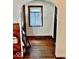 Welcoming entryway featuring hardwood floors, classic trim, and lots of natural light at 313 S Brittain Ave, Muncie, IN 47303