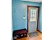 Inviting entryway featuring a stylish door with decorative window and a convenient shoe rack at 313 S Brittain Ave, Muncie, IN 47303