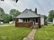 Charming home with a inviting front porch, brick accents and cozy appeal at 313 S Brittain Ave, Muncie, IN 47303