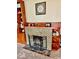 Stylish fireplace with decorative tile surround and flanking built-in shelving at 313 S Brittain Ave, Muncie, IN 47303
