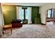 Bright living room featuring carpeted floors and lots of natural light at 313 S Brittain Ave, Muncie, IN 47303