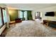 Spacious living room with carpet, neutral walls and natural light at 313 S Brittain Ave, Muncie, IN 47303