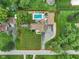 Aerial view of a home with a swimming pool, patio area, and red property line at 3707 E Wilson Dr, Mooresville, IN 46158