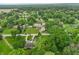 Aerial view showcasing the neighborhood with lush trees and a private backyard oasis at 3707 E Wilson Dr, Mooresville, IN 46158