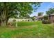 Spacious backyard showcasing a pool, patio, fence, mature trees, and shed for outdoor enjoyment at 3707 E Wilson Dr, Mooresville, IN 46158