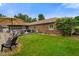 Spacious backyard with a pool, patio, lush lawn, and brick home exterior at 3707 E Wilson Dr, Mooresville, IN 46158