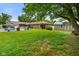 Large backyard featuring a pool, shed, lush lawn, mature trees, and privacy fence at 3707 E Wilson Dr, Mooresville, IN 46158