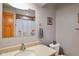 This bathroom boasts a shower with a linen curtain and a sink with a laminate countertop at 3707 E Wilson Dr, Mooresville, IN 46158