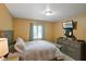 Neutral bedroom with a mounted tv, a window with blinds, and a modern bedspread at 3707 E Wilson Dr, Mooresville, IN 46158