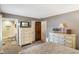 Bright bedroom boasts neutral walls, plush carpet, and easy access to the ensuite bathroom at 3707 E Wilson Dr, Mooresville, IN 46158