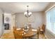 Cozy dining room featuring a wooden table set and a chandelier at 3707 E Wilson Dr, Mooresville, IN 46158