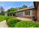 Brick ranch home featuring a charming front entrance with blue double doors and tidy landscaping at 3707 E Wilson Dr, Mooresville, IN 46158