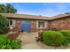Charming brick ranch home featuring blue double doors and beautiful landscaping at 3707 E Wilson Dr, Mooresville, IN 46158