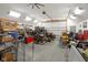 Spacious garage with a high ceiling, overhead lighting, and a plethora of storage possibilities at 3707 E Wilson Dr, Mooresville, IN 46158