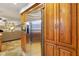 Modern kitchen with sleek stainless-steel refrigerator, plenty of storage space, and an easy flow to the living areas at 3707 E Wilson Dr, Mooresville, IN 46158