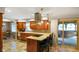 Charming kitchen with center island, breakfast bar, and views of the outdoor space, ideal for casual dining and relaxation at 3707 E Wilson Dr, Mooresville, IN 46158