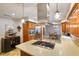 Well-appointed kitchen with stainless steel hood, and convenient access to the dining room, perfect for Gathering gatherings at 3707 E Wilson Dr, Mooresville, IN 46158