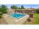 Backyard pool area featuring a pool with a slide, deck area, and well-maintained landscaping at 3707 E Wilson Dr, Mooresville, IN 46158