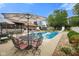 Outdoor patio with a pool, lush green lawn, and outdoor dining, perfect for summer fun at 3707 E Wilson Dr, Mooresville, IN 46158