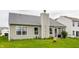 View of the house from the backyard showing well-maintained siding and established landscaping at 3872 Dusty Sands Rd, Whitestown, IN 46075