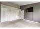 Open bedroom features carpet, ample closet space, and a wall-mounted tv at 3872 Dusty Sands Rd, Whitestown, IN 46075