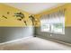 Vibrant bedroom is decorated with superhero themed wall art and a sunlit window at 3872 Dusty Sands Rd, Whitestown, IN 46075