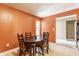 Inviting dining area features a round table with seating for four and a sunlit window at 3872 Dusty Sands Rd, Whitestown, IN 46075