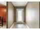 Bright hallway with tile flooring and a front door with glass panes, offering a welcoming entrance at 3872 Dusty Sands Rd, Whitestown, IN 46075