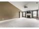 Bright and airy living room with carpet, featuring a ceiling fan and fireplace at 3872 Dusty Sands Rd, Whitestown, IN 46075