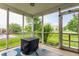 Relaxing screened porch with views of the landscaped yard and a comfortable seating area at 3872 Dusty Sands Rd, Whitestown, IN 46075