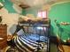 Bedroom featuring bunk beds, a window, dresser, and air conditioning unit at 403 N College Ave, Greencastle, IN 46135