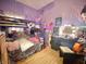 Fun bedroom featuring bunk beds, desk, and colorful decor at 403 N College Ave, Greencastle, IN 46135
