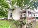 Charming home featuring a cozy front porch, brick accents, and landscaped yard at 403 N College Ave, Greencastle, IN 46135