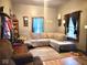 Cozy living room featuring a comfortable couch and large windows with natural light at 403 N College Ave, Greencastle, IN 46135