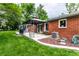 Well-maintained backyard with brick patio, gazebo, play set and lush green lawn at 4191 N Graham Rd, Whiteland, IN 46184