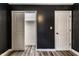 A bedroom with neutral floors, dark walls, and a walk-in closet at 4191 N Graham Rd, Whiteland, IN 46184