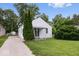 Charming one-story home with a well-maintained lawn, mature trees, and a paved driveway at 4310 Crittenden Ave, Indianapolis, IN 46205