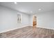 Bright, open living space featuring new wood-look floors and easy kitchen access at 4310 Crittenden Ave, Indianapolis, IN 46205