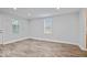 Bright living room featuring modern wood-look flooring, fresh white walls, and recessed lighting at 4310 Crittenden Ave, Indianapolis, IN 46205