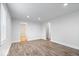 Open living room showcases modern wood-look floors with bright, neutral paint at 4310 Crittenden Ave, Indianapolis, IN 46205