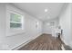 Bright room featuring wood floors, white walls, and lots of natural light from the windows at 4310 Crittenden Ave, Indianapolis, IN 46205