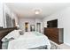 Spacious bedroom layout with a bed, dresser, and views into ensuite bathroom and closet at 561 Farnham Dr, Westfield, IN 46074