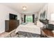 Comfortable bedroom featuring modern furnishings, a large window, and a TV on the dresser at 561 Farnham Dr, Westfield, IN 46074
