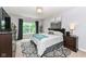 Cozy bedroom featuring a comfortable bed, dark wood furniture, neutral tones, and natural light at 561 Farnham Dr, Westfield, IN 46074