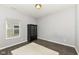 Neutral bedroom featuring a large window, modern floors, and a black wood cabinet at 561 Farnham Dr, Westfield, IN 46074