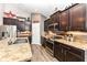 Well-equipped kitchen features stainless steel appliances, dark cabinetry and ample counter space at 561 Farnham Dr, Westfield, IN 46074