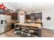 Stylish kitchen with dark cabinets, stainless steel appliances, and a large island for entertaining at 561 Farnham Dr, Westfield, IN 46074