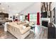 Bright living area featuring a fireplace, vaulted ceilings, and seamless flow to the kitchen and dining spaces at 561 Farnham Dr, Westfield, IN 46074